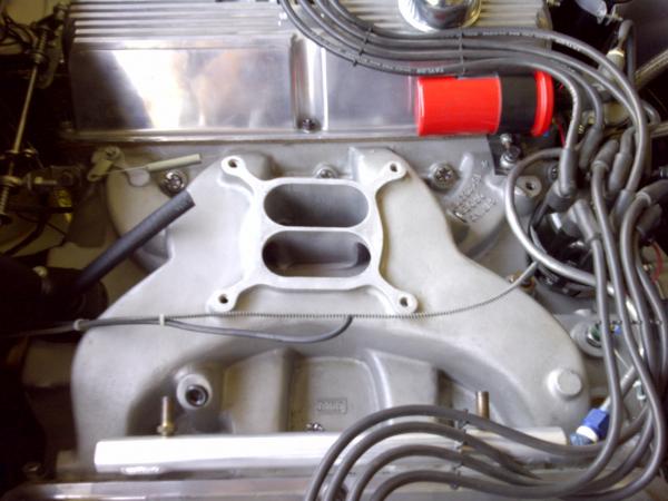 Engine installed and waiting for the new carb.  The old Sidewinder intake cleaned up pretty well.