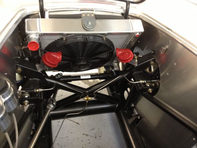 Coil spring frame and suspension, narrowed to accomodate a small block (302 Ford) in the original, slab-side body.