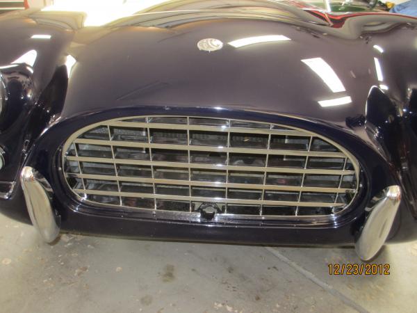 There is a hole in the grille like an old Ford to start the engine.  There is no hole in the radiator or connection to the engine to actually start the engine with the hole.
