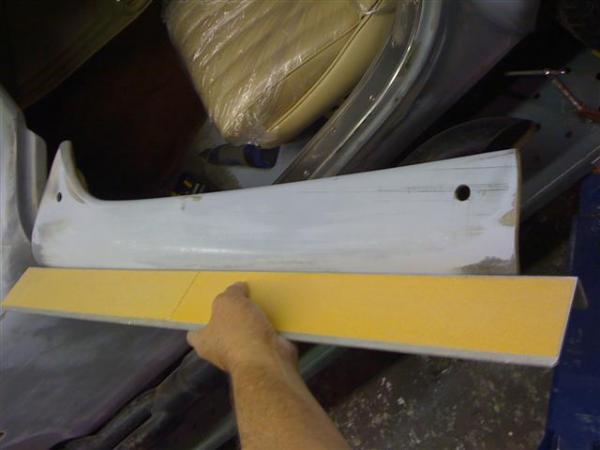Testing out the sanding block on the door.