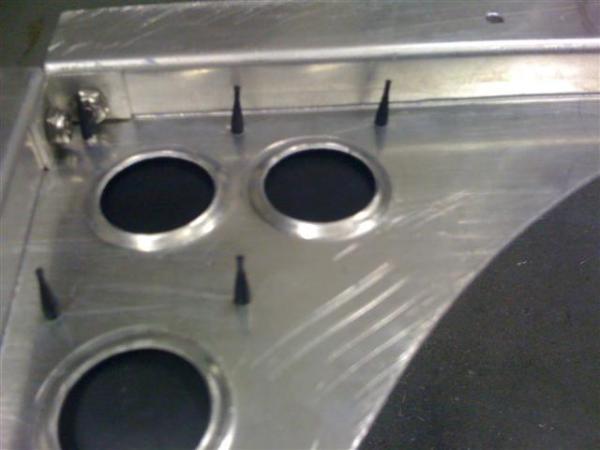 The custom fan shroud that I made with rubber flaps.  Shown from behind with dimples made with my home made dimpling tool.  Fortunately I have a lathe and can make fun stuff.