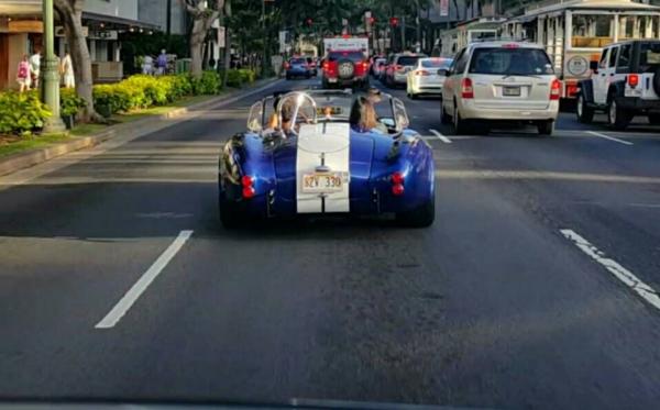 Going down Kalakaua Avenue in Waikiki.