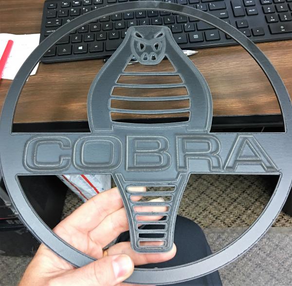 Laser Cut and Etched.  Painted prior to cutting.