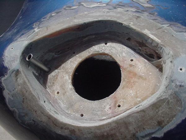 frenched fuel cap pocket with drain to ground