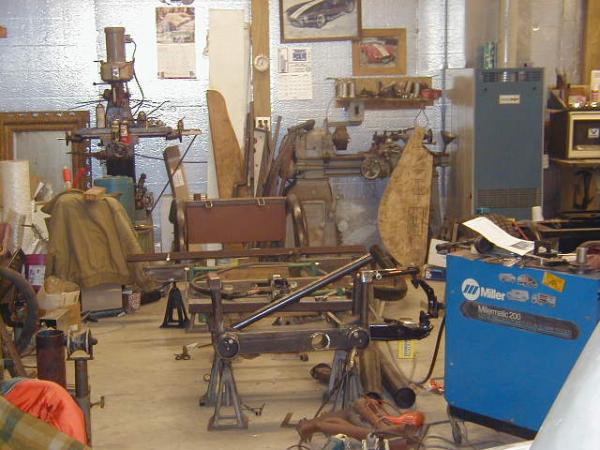 The chassis began as two lengths of 4" steel tubing on jack stands.  All parts were cut out by hand, assembled and hand welded to form the completed chassis.