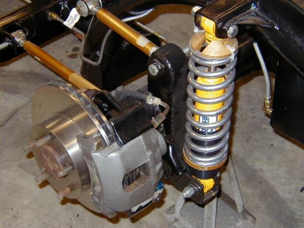 Closeup of rear suspension and brakes.