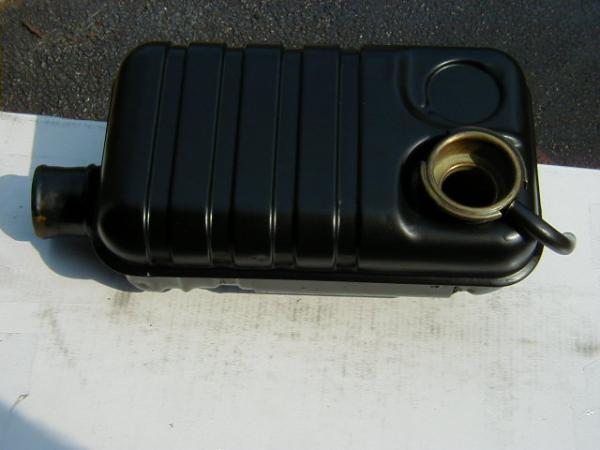 Original Fe expansion tank modified to fit smallblock Ford intake manifold.