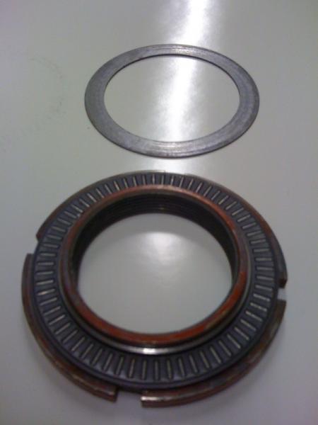 Putting the needle bearing on the shock adjusting nut.