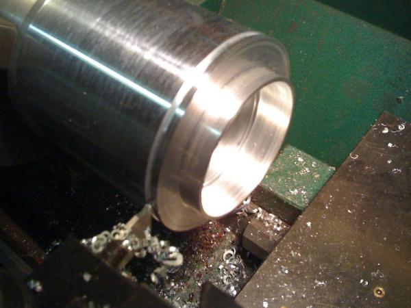 Machining up the concentric spacers to locate the shock coil-over springs and keep then centered on the Needle Roller thrust bearing.