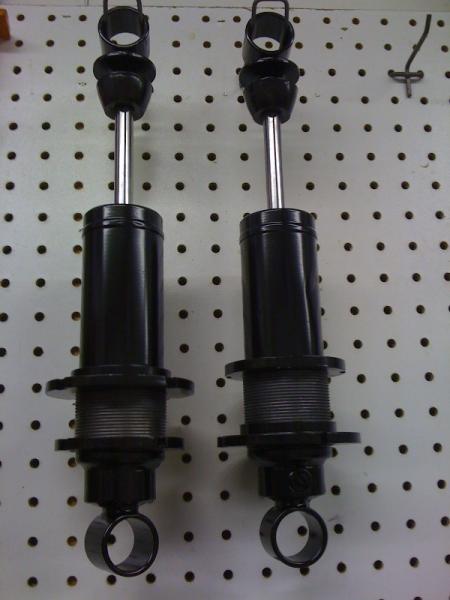Rear shocks ready for springs and needle thrust adjusters.