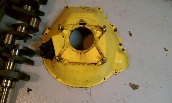 Had to take the bellhousing off to get the transmission out. It wouldn't fit down between the frame rails so I took it off and pulled it up through the engine compartment and dropped the rest through the bottom.