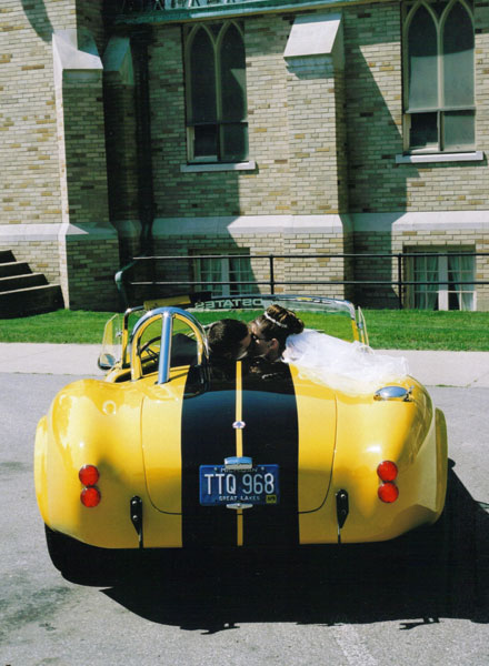 My sisters friend Michelle and her new husband borrowed the Cobra for their wedding. She kindly sent me a few photos from her album. Here's shot of them kissing.