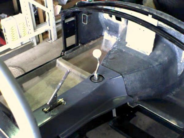 Cobra floorpanels1   New fiberglass floorpans lower the floor 2-1/4"   You can see the shadows of the new steel seat mounts through the fiberglass.
