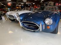 Two original Cobras.  Note the flip down license plate bracket on the blue 427s grill hoop.