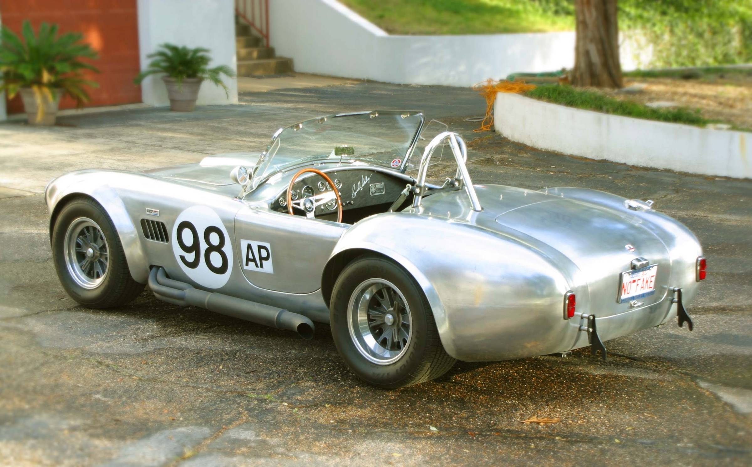 15281car_left_rear_at_house_nice_lo_res