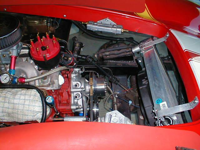 10047Closeupofupperradiatormountsandoilfilterrelocationatfarside