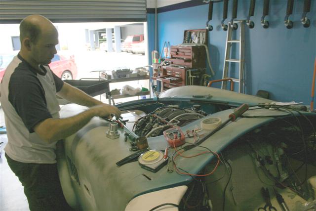 Sideshows_mate_wires_up_the_engine_loom_Small_